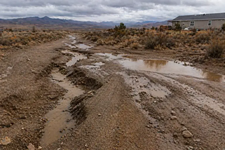 Poor land grading causing water pooling and erosion
