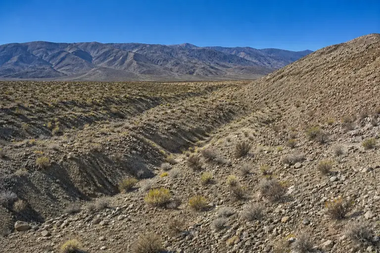 Remote raw land with no access road, rough terrain and development obstacles in Elko County